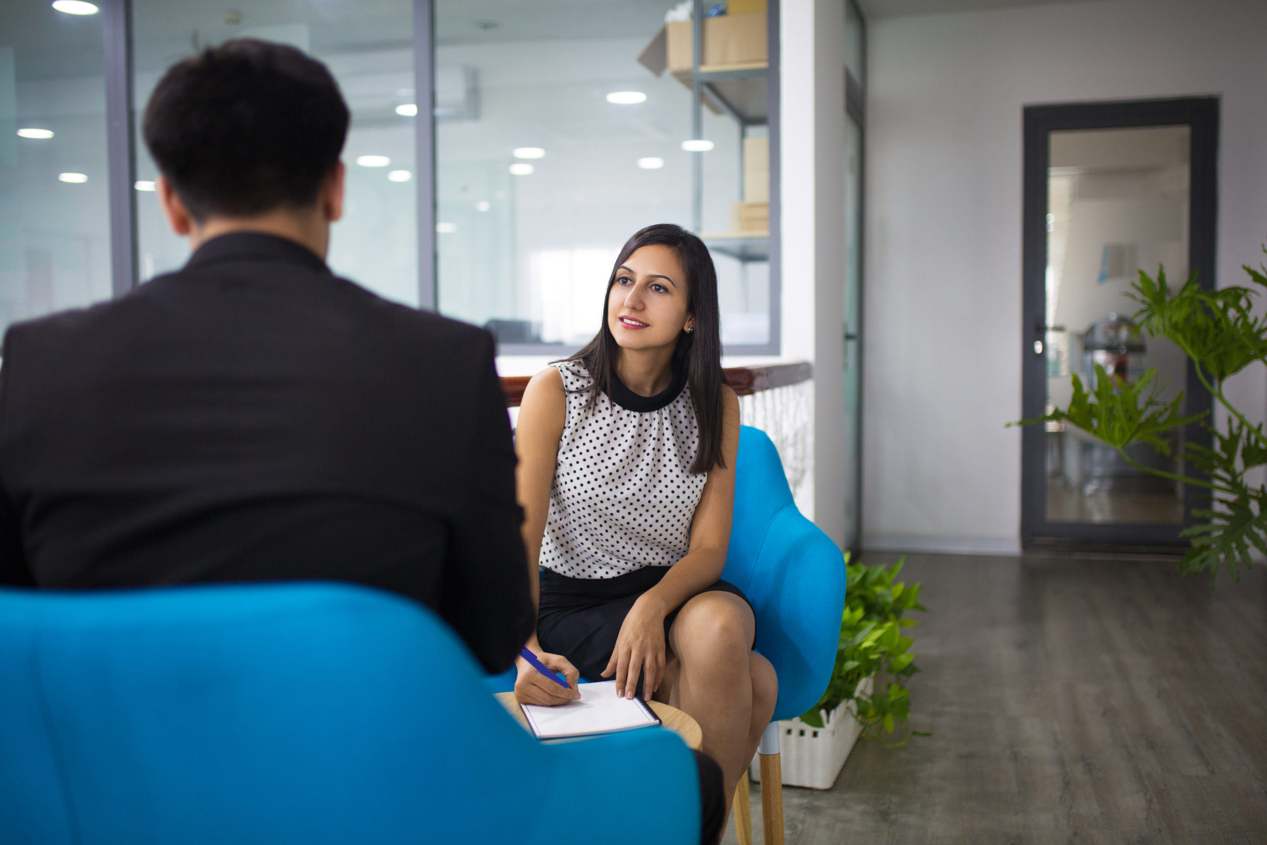 Portrait of smiling hr manager having interview with candidate » The HR Suite